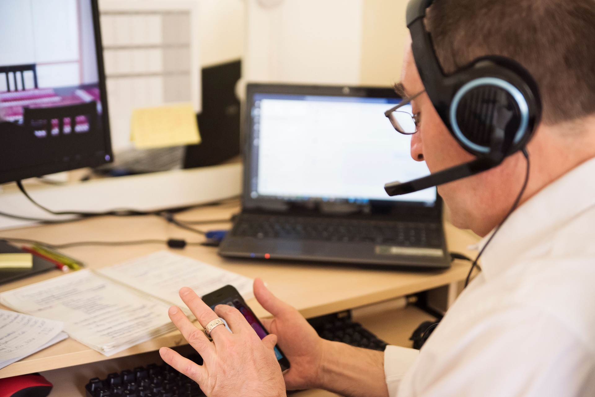 Mature man working in temporary home office.